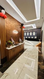 a lobby with a reception desk with red balloons at Hotel Ratnam Palace Maheshwar in Maheshwar