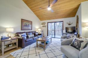 a living room with a couch and a tv at Stunning Sapphire Valley Resort Townhome with Perks! in Sapphire