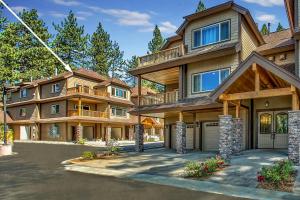 a large house with a garage in front of it at Conifer Chalet in South Lake Tahoe