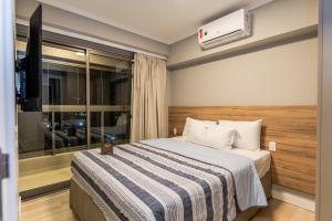 Apartamentos Studio Allure Moema - Com café da manhã opcional, Recepção e Valet 24 horas客房内的一张或多张床位
