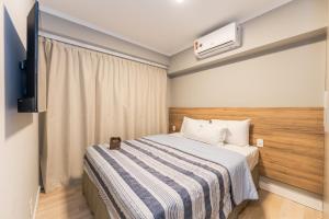 Apartamentos Studio Allure Moema - Com café da manhã opcional, Recepção e Valet 24 horas客房内的一张或多张床位