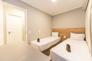 Apartamentos Studio Allure Moema - Com café da manhã opcional, Recepção e Valet 24 horas客房内的一张或多张床位