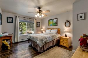 a bedroom with a bed and a ceiling fan at Sundown Lodge in Stateline