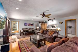 a living room with a couch and a table at Sundown Lodge in Stateline