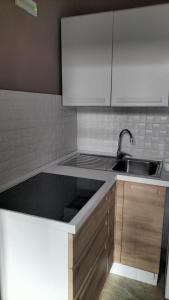 a kitchen with a sink and a counter top at Gi&Sa in Gallipoli