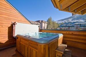 a hot tub sitting on the side of a building at Downtown Penthouse in South Lake Tahoe