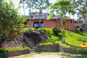 a house with stairs in front of it at Pousada Trancoso Guarapari in Guarapari