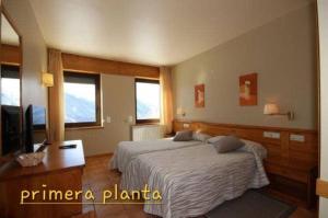 Posteľ alebo postele v izbe v ubytovaní Hotel Seixes y Apartamento Bagergue