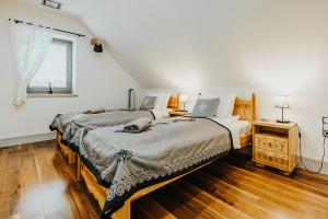 Postel nebo postele na pokoji v ubytování Ceprowo
