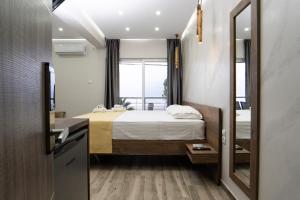 Postel nebo postele na pokoji v ubytování Nikolaidis Apartments