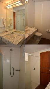 ein Bad mit einem Waschbecken, einer Dusche und einem WC in der Unterkunft Atibaia Residence Hotel & Resort in Atibaia