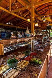 a buffet line with many different types of food at Palmetto Resort Hotel Selimiye in Selimiye