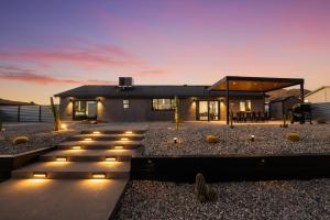 a house with lights in front of it at Desert Oasis in Joshua Tree