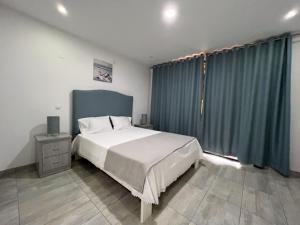 Postel nebo postele na pokoji v ubytování Casa dos Arcos