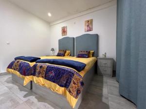 Postel nebo postele na pokoji v ubytování Casa dos Arcos