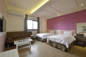 Ένα ή περισσότερα κρεβάτια σε δωμάτιο στο Zhaody Hotel