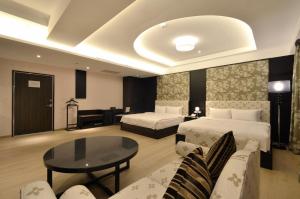 Ένα ή περισσότερα κρεβάτια σε δωμάτιο στο Zhaody Hotel