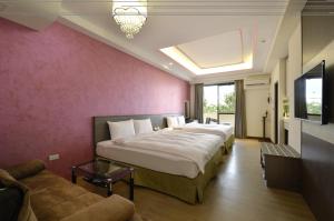 Ένα ή περισσότερα κρεβάτια σε δωμάτιο στο Zhaody Hotel