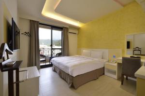 Ένα ή περισσότερα κρεβάτια σε δωμάτιο στο Zhaody Hotel