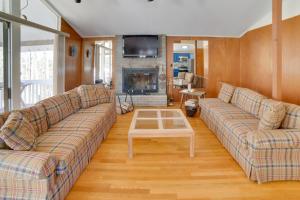 a living room with two couches and a coffee table at Londonderry Vacation Home with Deck and Gas Grill! in Londonderry