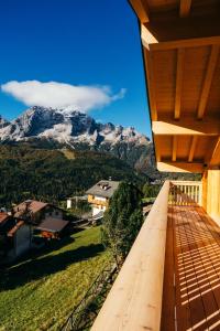 a view of a mountain from the balcony of a house at Chalet M in Val di Zoldo
