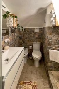 a bathroom with a toilet and a sink at Ursino holiday apartment in Catania