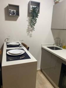 a small kitchen with a stove and a sink at Studio Moderne au centre de ville casablanca à Louer in Casablanca