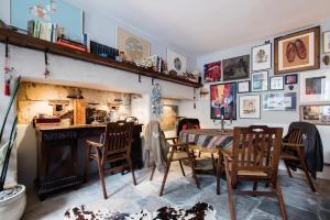 a dining room with a table and chairs and a fireplace at Jane Austen's Family Home in Bath from 1801 to 1805 in Bath +6 photos