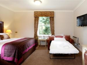 Posteľ alebo postele v izbe v ubytovaní Macdonald Kilhey Court Hotel & Spa