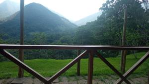 a view of a valley with mountains in the background at Pousada Vereda Tropical in Paraty