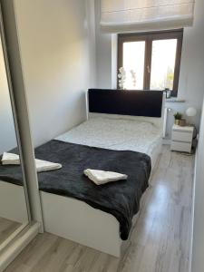 Voodi või voodid majutusasutuse Apartament w centrum miasta toas