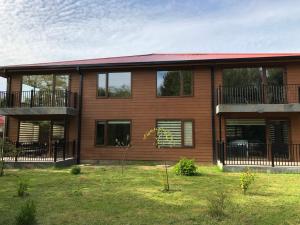 a large house with a yard in front of it at mirabosque new aparments 2 in Osorno