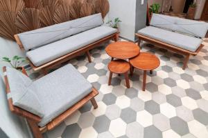 a room with two benches and a table and chairs at Casa del Desierto in Guadalajara
