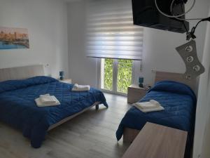 Postel nebo postele na pokoji v ubytování BED & BREAKFAST VAL di ERICE