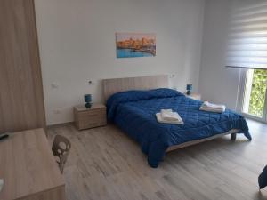 Postel nebo postele na pokoji v ubytování BED & BREAKFAST VAL di ERICE