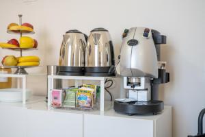 a kitchen with a coffee maker on a counter at B&b Meridia in Catania +22 photos