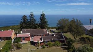 an aerial view of a house with the ocean in the background at Shepherd's Rest in Mossel Bay