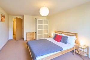 a bedroom with a large bed with two pillows at Host & Stay - Bingley Court in Canterbury