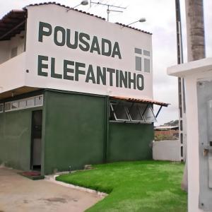 a sign for a pueblo elfilino building at Pousada Elefantinho in São Pedro da Aldeia
