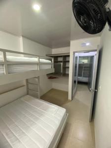 Ένα ή περισσότερα κρεβάτια σε δωμάτιο στο Hotel Paraíso Real NB +5 φωτογραφίες