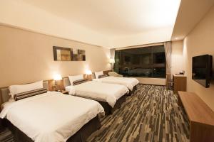 Кровать или кровати в номере The Fuli Resort Chihpen