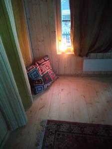 an empty room with a couch and a window at Garden Chamber in Rovaniemi