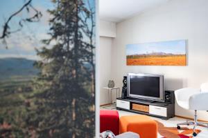 TV a/nebo společenská místnost v ubytování Lucky Lodge