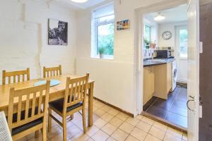 a kitchen and dining room with a table and chairs at Host & Stay - Prospect Place in Canterbury