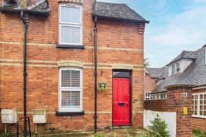 a red brick house with a red door at Host & Stay - Prospect Place in Canterbury