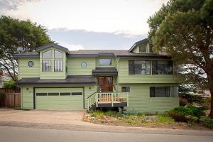 a large green house with a garage at 430 Orlando in Cambria