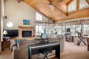 a living room with a couch and a piano at 430 Orlando in Cambria