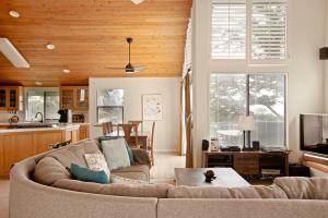 a living room with a couch and a kitchen at 430 Orlando in Cambria