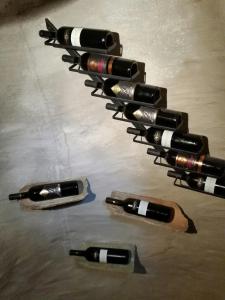 a group of wine bottles on a table at Petrarussa Dimora Storica in Morciano di Leuca