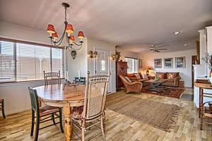 a dining room and living room with a table and chairs at 275 Stafford in Cambria